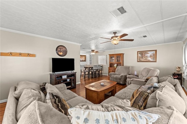 41050 Mohawk Cir, Cherry Valley, CA 92223 - living room with wood finished floors, a ceiling fan, and crown molding