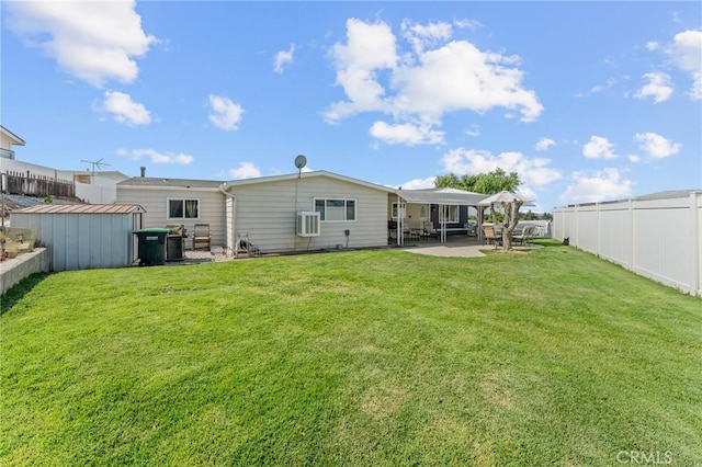 41050 Mohawk Cir, Cherry Valley, CA 92223 - back of house featuring a patio area, a fenced backyard, and a shed