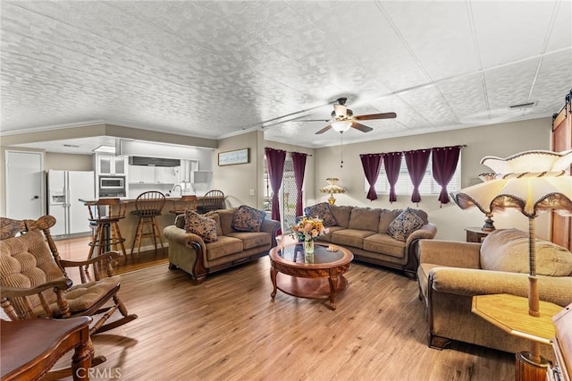 41050 Mohawk Cir, Cherry Valley, CA 92223 - living room featuring light wood-type flooring and ceiling fan