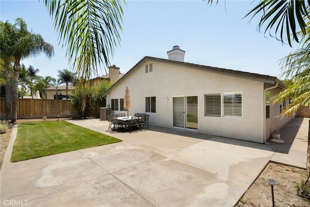 1167 Belridge Pl, Corona, CA 92881 - back of property with a chimney, stucco siding, and a patio