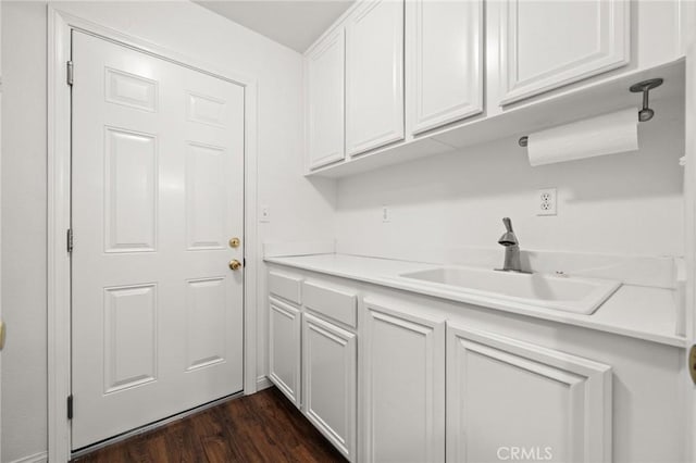 1167 Belridge Pl, Corona, CA 92881 - laundry room featuring a sink and dark wood-style floors
