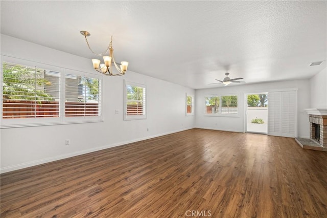 1167 Belridge Pl, Corona, CA 92881 - unfurnished living room featuring a chandelier, wood finished floors, a fireplace, and ceiling fan