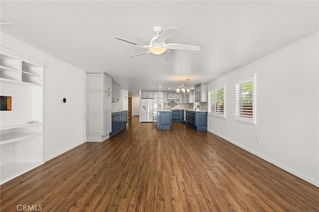 1167 Belridge Pl, Corona, CA 92881 - unfurnished living room with a chandelier, ceiling fan, and dark wood-style floors