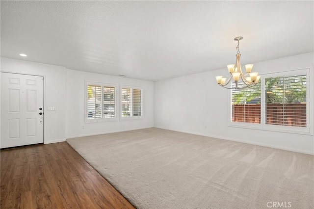 1167 Belridge Pl, Corona, CA 92881 - empty room with a chandelier, plenty of natural light, wood finished floors, and recessed lighting