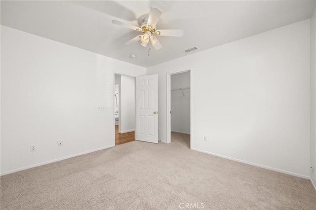 1167 Belridge Pl, Corona, CA 92881 - unfurnished bedroom with light colored carpet, a ceiling fan, and a spacious closet