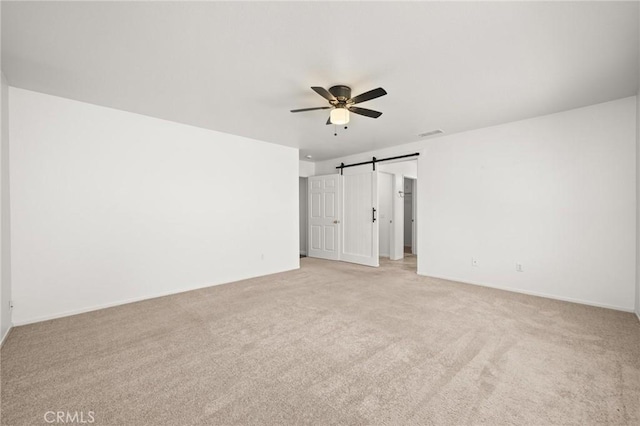 1167 Belridge Pl, Corona, CA 92881 - empty room with ceiling fan, light carpet, and a barn door