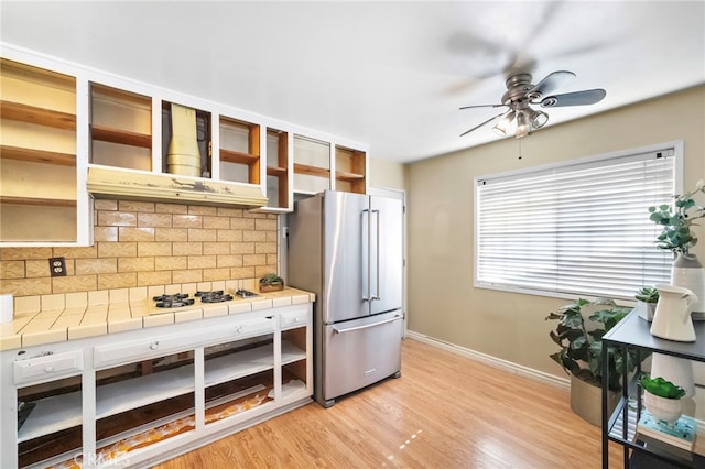 6182 Anthony Ave, Garden Grove, CA 92845 - kitchen featuring high quality fridge, open shelves, backsplash, ceiling fan, and tile counters