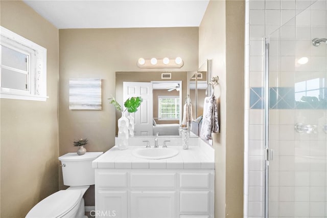 6182 Anthony Ave, Garden Grove, CA 92845 - bathroom featuring a shower stall, vanity, and a ceiling fan