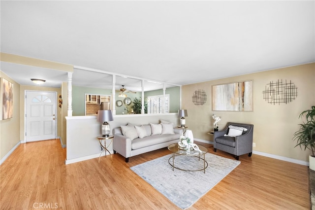 6182 Anthony Ave, Garden Grove, CA 92845 - living room with wood finished floors, a ceiling fan, and decorative columns