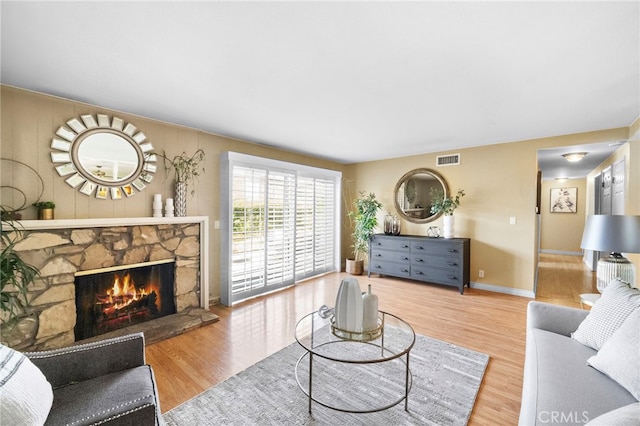 6182 Anthony Ave, Garden Grove, CA 92845 - living room featuring wood finished floors and a fireplace