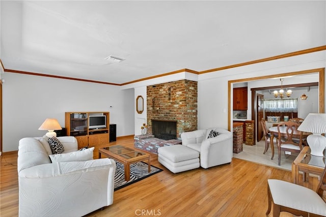 15747 Addison St, Encino, CA 91436 - living room featuring a chandelier, light wood-style floors, crown molding, and a brick fireplace
