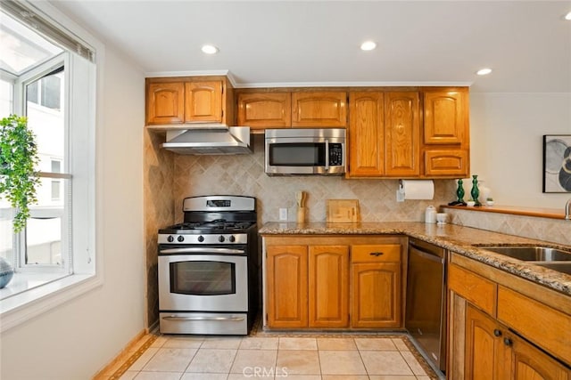 4320 W Kling St Unit 27, Burbank, CA 91505 - kitchen with appliances with stainless steel finishes, plenty of natural light, extractor fan, brown cabinets, and recessed lighting