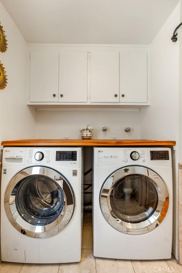 4320 W Kling St Unit 27, Burbank, CA 91505 - laundry room with washing machine and clothes dryer, cabinet space, and light tile patterned flooring