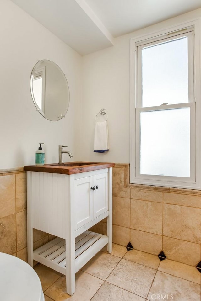 4320 W Kling St Unit 27, Burbank, CA 91505 - bathroom featuring tile walls, tile patterned flooring, vanity, and wainscoting