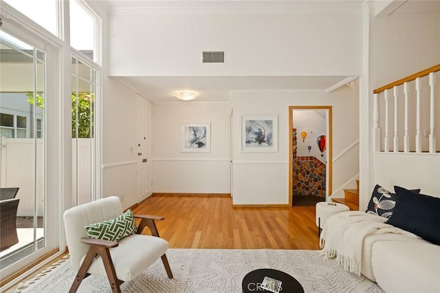 4320 W Kling St Unit 27, Burbank, CA 91505 - living room featuring light wood-type flooring, stairs, and ornamental molding