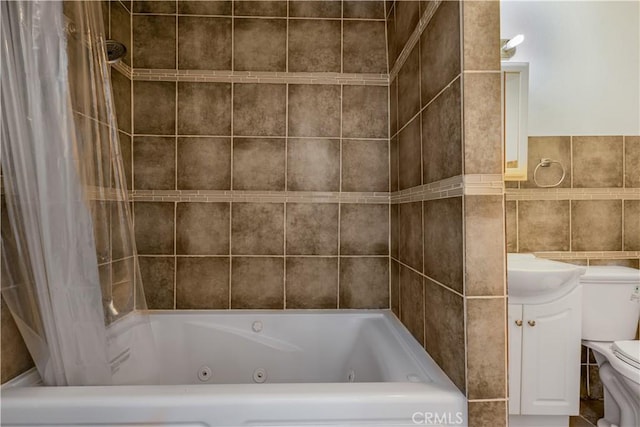 3935 Lime Ave, Long Beach, CA 90807 - bathroom featuring tile walls, a combined bath / shower with jetted tub, and vanity