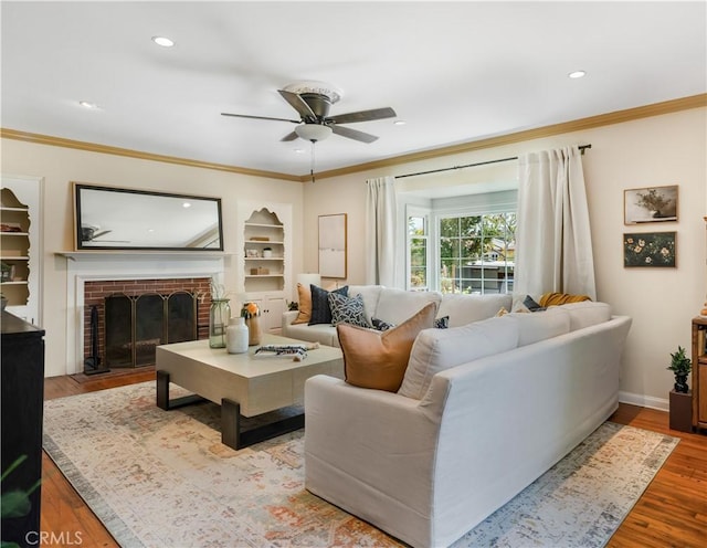 3935 Lime Ave, Long Beach, CA 90807 - living room with a ceiling fan, wood finished floors, crown molding, recessed lighting, and built in shelves