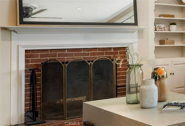 3935 Lime Ave, Long Beach, CA 90807 - detailed view of a fireplace and a ceiling fan