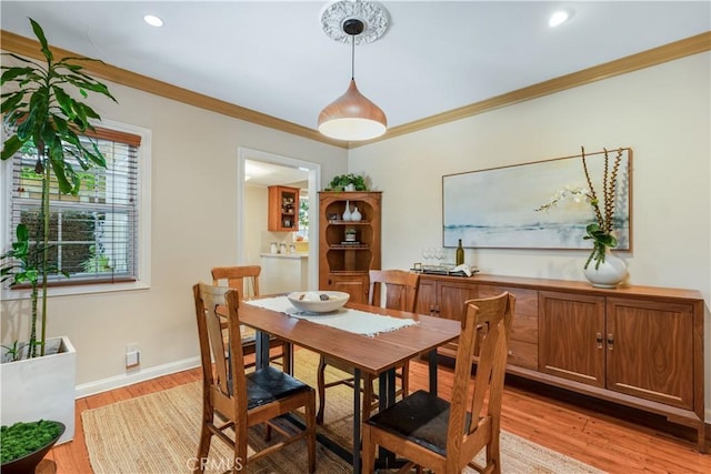 3935 Lime Ave, Long Beach, CA 90807 - dining space with light wood finished floors, crown molding, and recessed lighting