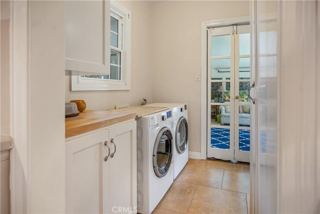 3935 Lime Ave, Long Beach, CA 90807 - laundry area with washing machine and clothes dryer, cabinet space, and light tile patterned flooring