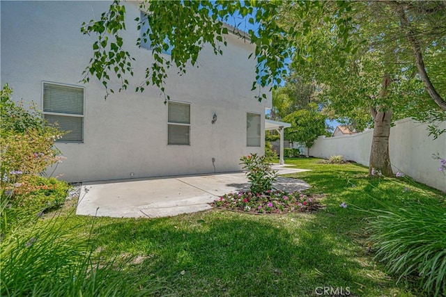 25868 Hammet Cir, Stevenson Ranch, CA 91381 - rear view of house featuring a patio, a fenced backyard, and stucco siding