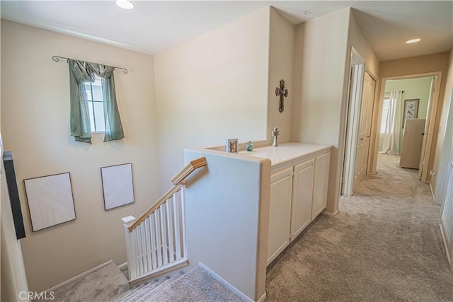25868 Hammet Cir, Stevenson Ranch, CA 91381 - hallway featuring an upstairs landing, light colored carpet, and recessed lighting