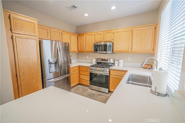 25868 Hammet Cir, Stevenson Ranch, CA 91381 - kitchen with stainless steel appliances, light countertops, light brown cabinetry, and recessed lighting