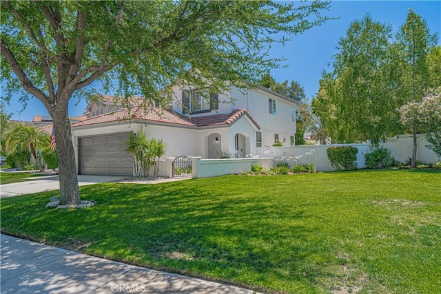 25868 Hammet Cir, Stevenson Ranch, CA 91381 - mediterranean / spanish-style house with a fenced front yard, stucco siding, a tile roof, driveway, and a garage