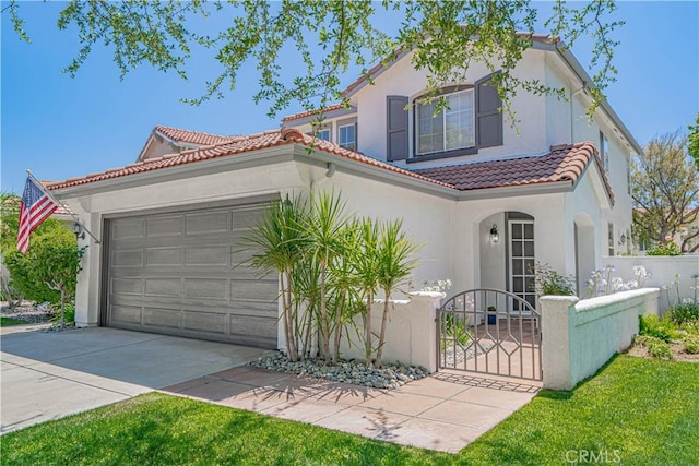 25868 Hammet Cir, Stevenson Ranch, CA 91381 - mediterranean / spanish home with a tile roof, a fenced front yard, an attached garage, driveway, and stucco siding