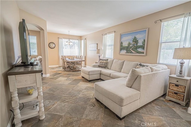 25868 Hammet Cir, Stevenson Ranch, CA 91381 - living room featuring stone tile flooring and arched walkways