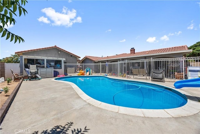 18043 Preston St, Hesperia, CA 92345 - view of swimming pool with a water slide and a patio