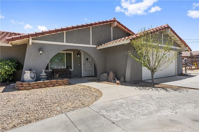 18043 Preston St, Hesperia, CA 92345 - view of front of home featuring stucco siding, a garage, driveway, and a tiled roof