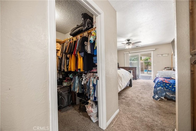 18043 Preston St, Hesperia, CA 92345 - carpeted bedroom featuring a textured ceiling, a textured wall, access to exterior, and a walk in closet