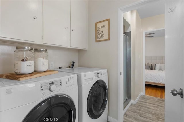 5527 Elmbank Rd, Rancho Palos Verdes, CA 90275 - laundry room featuring washer and dryer, cabinet space, and light wood-style flooring