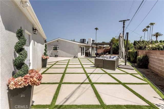 16652 Itasca St, Northridge, CA 91343 - fenced backyard featuring an outdoor hangout area and a patio