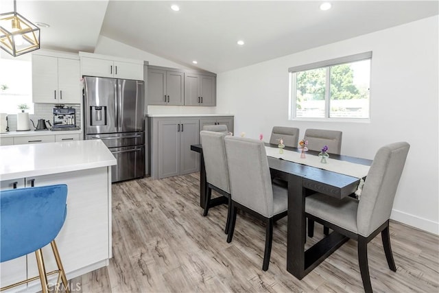 16652 Itasca St, Northridge, CA 91343 - dining area featuring vaulted ceiling, light wood-style flooring, and recessed lighting