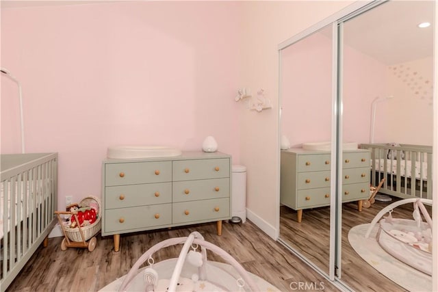16652 Itasca St, Northridge, CA 91343 - bedroom featuring wood finished floors, a closet, and a nursery area