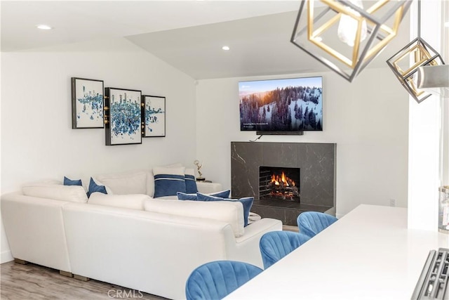 16652 Itasca St, Northridge, CA 91343 - living room featuring wood finished floors, a premium fireplace, recessed lighting, and vaulted ceiling