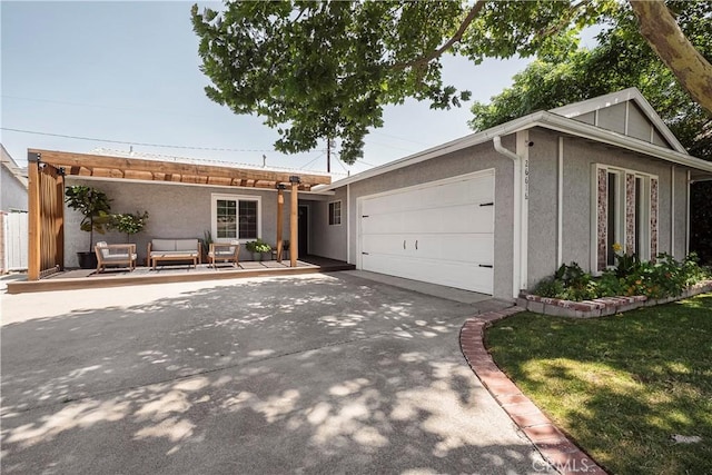 26616 Balerna Dr, Saugus, CA 91350 - ranch-style house featuring stucco siding, a garage, an outdoor hangout area, and driveway