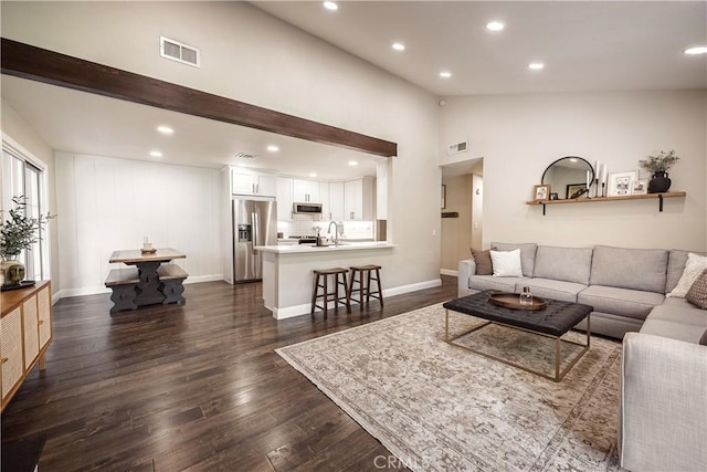 26616 Balerna Dr, Saugus, CA 91350 - living room with lofted ceiling, dark wood finished floors, and recessed lighting