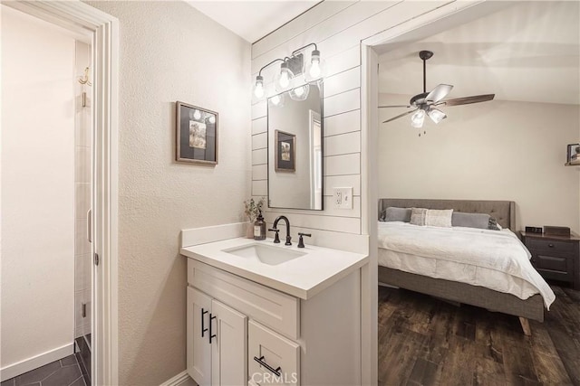 26616 Balerna Dr, Saugus, CA 91350 - bedroom with dark wood finished floors, a textured wall, and a ceiling fan