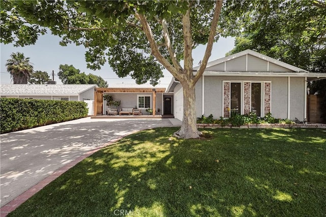 26616 Balerna Dr, Saugus, CA 91350 - view of front of home featuring a front yard and stucco siding
