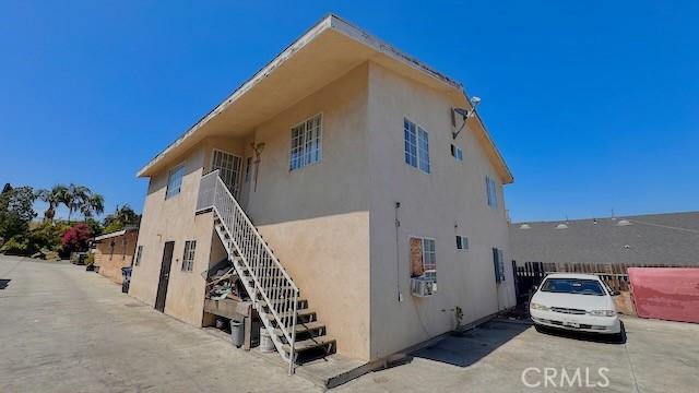3844 Whiteside St, East Los Angeles, CA 90063 - view of side of property featuring stairway and stucco siding