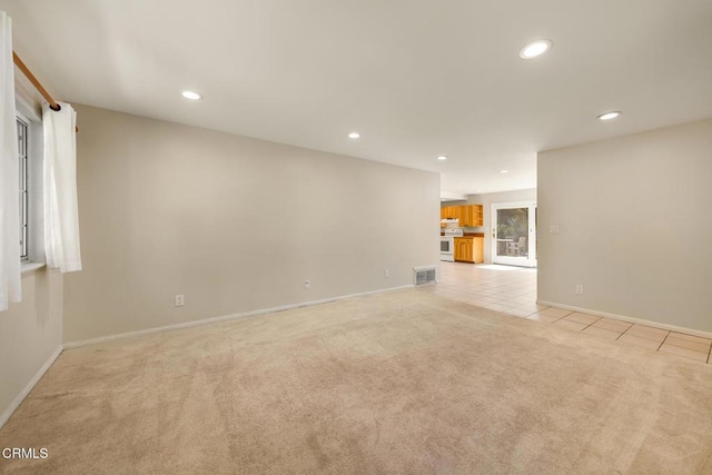 1104 Mariano Dr, Ojai, CA 93023 - unfurnished living room featuring light colored carpet, recessed lighting, and light tile patterned floors