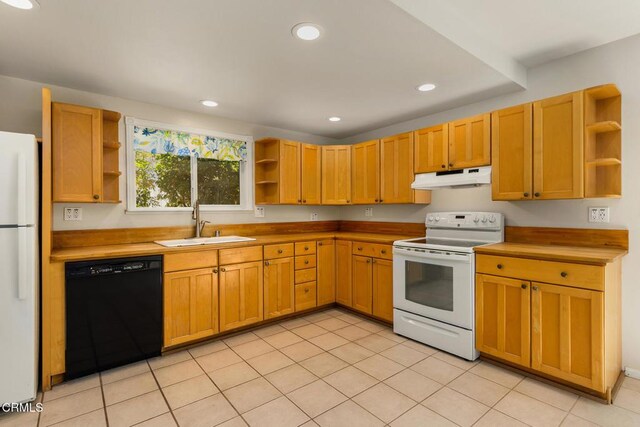 1104 Mariano Dr, Ojai, CA 93023 - kitchen with open shelves, white appliances, under cabinet range hood, recessed lighting, and light tile patterned flooring