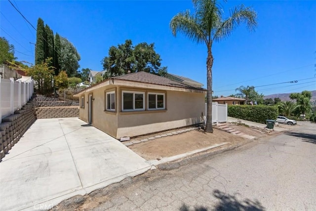 1151 El Camino Real, Simi Valley, CA 93063 - view of side of property with stucco siding and a patio area