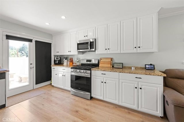 1151 El Camino Real, Simi Valley, CA 93063 - kitchen featuring stainless steel appliances, white cabinetry, light wood finished floors, recessed lighting, and light stone countertops
