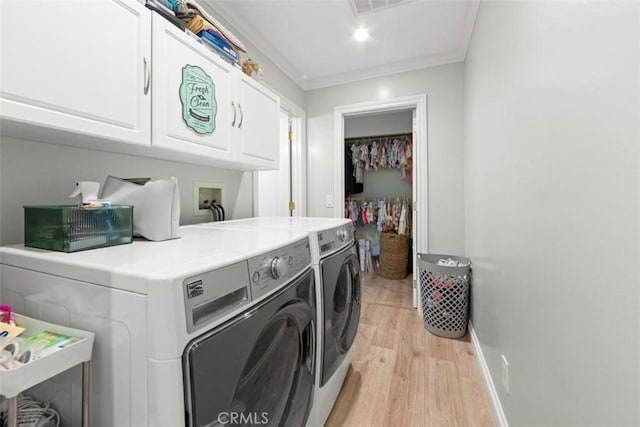 1151 El Camino Real, Simi Valley, CA 93063 - laundry area with cabinet space, washer and clothes dryer, light wood-style floors, and crown molding