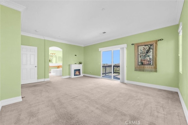 16461 Medinah St, Fontana, CA 92336 - unfurnished living room with carpet, arched walkways, a lit fireplace, and crown molding