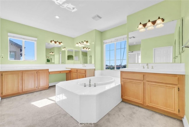 16461 Medinah St, Fontana, CA 92336 - bathroom with two vanities, a bath, and a shower stall